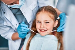when should kids first visit the dentist